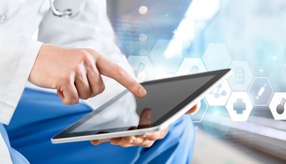 Poster - Doctor at hospital working with tablet pc