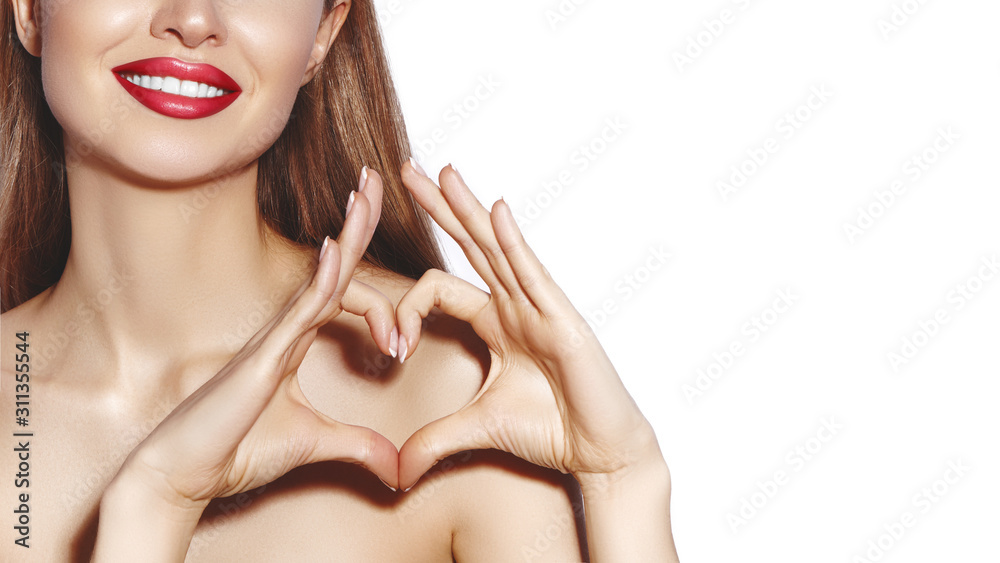 Romantic young Woman making Heart Shape with her Fingers. Love and Valentines Day Symbol. Fashion girl with Happy Smile - obrazy, fototapety, plakaty 