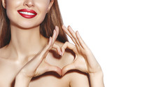 Romantic Young Woman Making Heart Shape With Her Fingers. Love And Valentines Day Symbol. Fashion Girl With Happy Smile