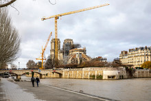 Paris, France - December 22, 2019: View Of Cranes And Scaffoldings On The Notre Dame De Paris Cathedral On The Ile De La Cite In The Center Of Paris After It Was Damaged By A Fire In April 2019