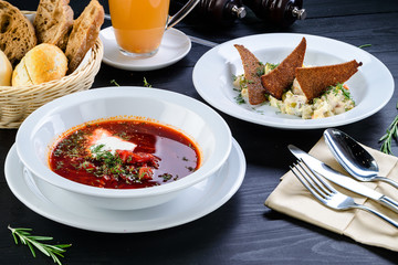 Wall Mural - Russian three-course dinner, borsch and Olivier salad