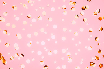 Wall Mural - Pink confetti and stars and sparkles on pink background.