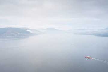 Ferry ship crossing on open vast ocean cruise journey aerial view from above during atmospheric weather sea island trip Scotland UK