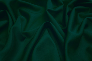 Wall Mural - Luxurious woolen fabric in dark green. Background and pattern.