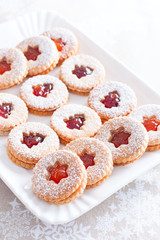 Wall Mural - Traditional christmas linzer cookies on a white dish, selective focus