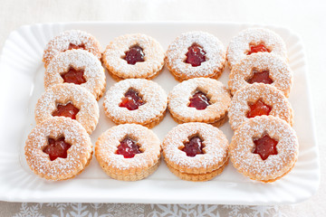 Wall Mural - Traditional Christmas linzer cookies on a white dish, horizontal