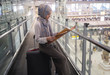 © Asada - Asian muslim tourist looking on the map to get the direction of destination way when she arrived at Airport. travel and tourism concept.
