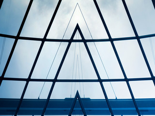 Poster - Collage photo of glass ceiling or roof with girder. Minimal business building interior. Abstract modern architecture background with hi-tech geometric structure of polygonal frame glazing pattern.