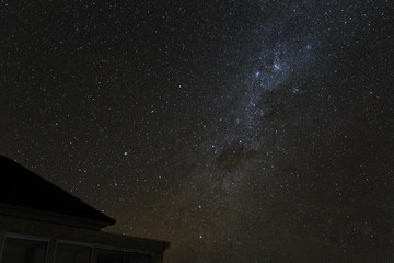 Milky Way and starry night sky over the mountains on the island of Bali