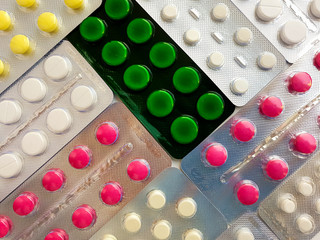 Pharmaceuticals. Antibiotics, various pills on a white background.