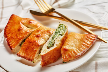 Wall Mural - close-up of a calzone with Spinach and Cheese