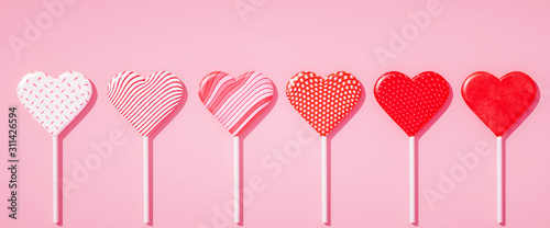 Photographie Flat lay lollipops on stick in row with different pattern textures, love concept