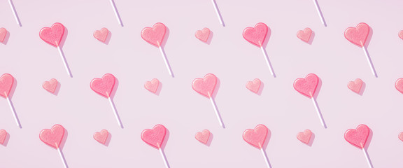 Pastel pink Flat lay heart shape lollipop on stick pattern Valentine day background. 3d rendering.