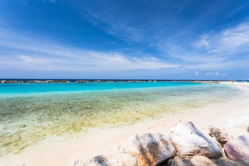 Amazing view of turquoise water of Atlantic ocean and blue sky with white clouds. Curacao island.. Beautiful nature background.