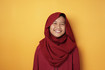 Wall Mural - Asian Muslim Teenage Girl Wearing Hijab Smiling at Camera