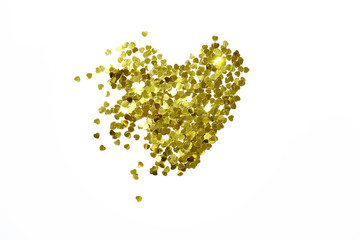 Wall Mural - background, golden sparkles of hearts confetti laid out in the shape of a heart