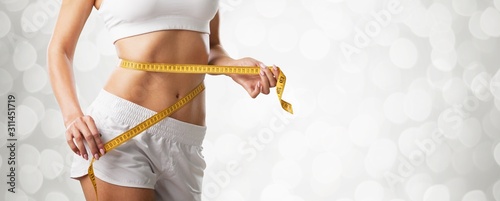 Cuadros en Lienzo Fitness woman weight loss, slim body, healthy lifestyle concept