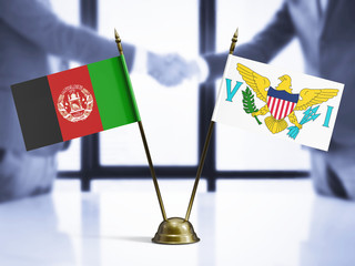 Wall Mural - United States Virgin Islands and Afghanistan mini table flags on white wooden desk. Diplomatic background with men shaking hands, international relations and agreements.