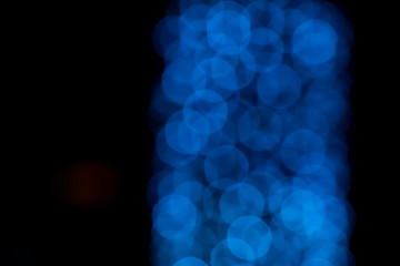 Defocused of blurred blue bokeh circle light from lighting bulb in the night for abstract background texture patterns