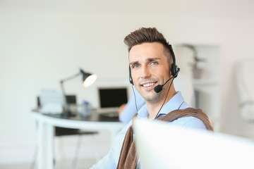 Poster - Male technical support agent working in office