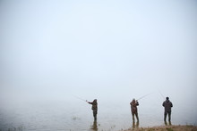 Fishermen On The River In The Fog With Copy Space