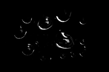 Sticker - drops of water on a black background