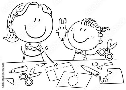 Mother or teacher and a little girl enjoy crafting together