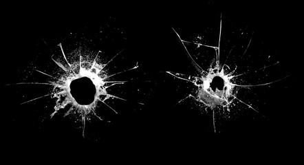 Poster - hole in the glass with cracks isolated on a black background