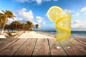 Canvas Print - Lemonade with fresh sliced lemon on desk