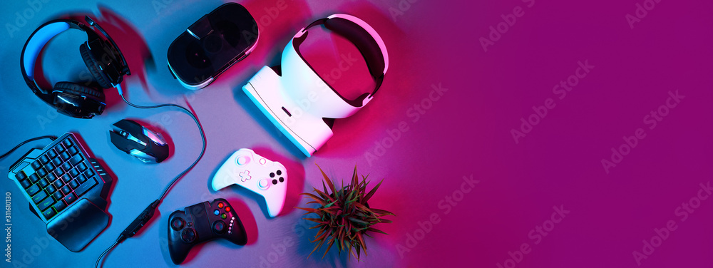 Keyboard, mouse, gamepad, virtual reality headset and headphones. - obrazy, fototapety, plakaty 