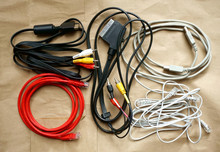 A Collection Of Old Electric Wires, Scart And Telephone Cables Tangled On The Paper Background