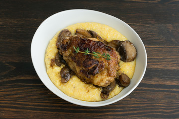 Wall Mural - Braised Chicken Thighs with Mushrooms and Creamy Polenta