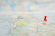 Selective focus of Red pin on map background