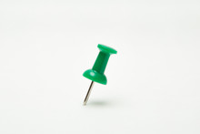 Close Up Of Green Pin  On White Background