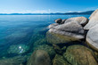 USA, Nevada, Washoe County, Incline Village. The blue expanse of Lake Tahoe with granite boulders along the shore.