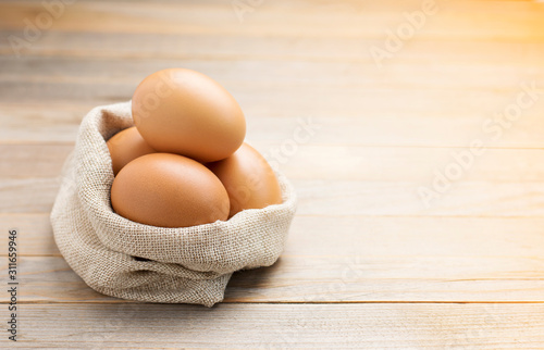 Fotomural Fresh eggs from the farm placed on an old wooden table with copy space