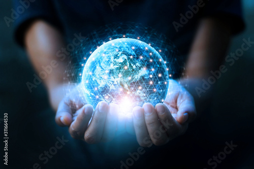 Cuadros en Lienzo Man hands holding blue earth and global networking connection and data exchanges, global communication network concept, Elements of this image furnished by NASA