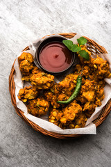 Wall Mural - Crispy Corn pakora/pakoda, bhajji, Bhaji, bajji or pattice . served with tomato ketchup