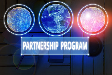Poster - Writing note showing Partnership Program. Business concept for selling the vendor s is products and associated services Elements of this image furnished by NASA