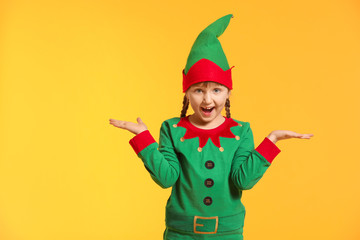 Sticker - Surprised girl in costume of elf on color background