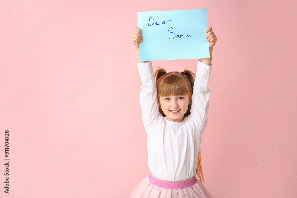 Cute little girl with letter to Santa Claus on color background