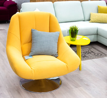 Stylish Designer Chair In Yellow On The Background Of Furniture Sales. Comfortable And Upholstered Furniture, New, Beautiful