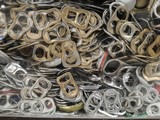 Fototapeta Młodzieżowe - close up of a pile of metal Aluminum hoops from beverage cans