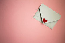 White Postal Envelope On A Pink Background, With Paper Hearts, Heart In The Form Of Paper, Layout For Valentine's Day
