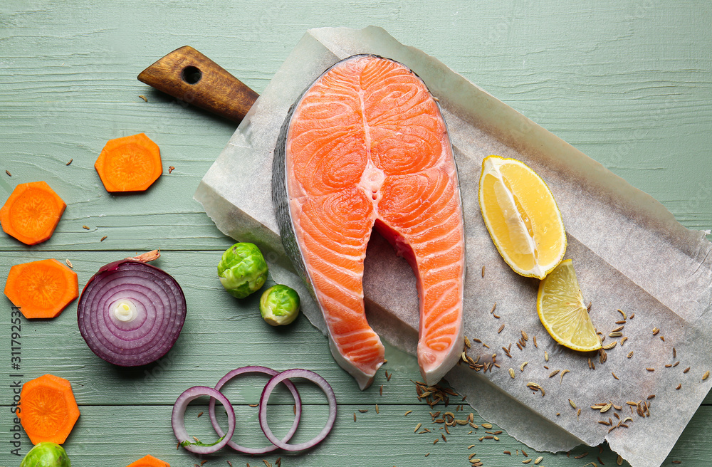 Composition with raw salmon on table