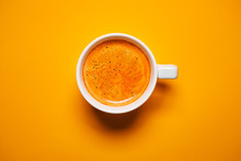 Black Coffee In A Cup On A Orange Background