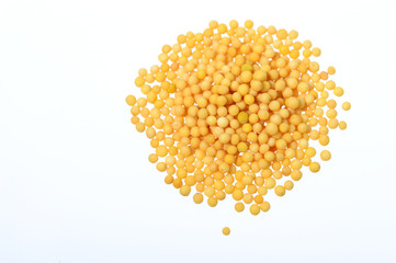 Yellow Mustard Seeds on a white background