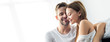 © LIGHTFIELD STUDIOS - panoramic shot of handsome man hugging smiling woman in apartment