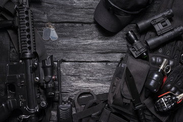 Wall Mural - Rifle, radio station, binoculars, handcuffs, knife on the special force agent table with copy space concept.