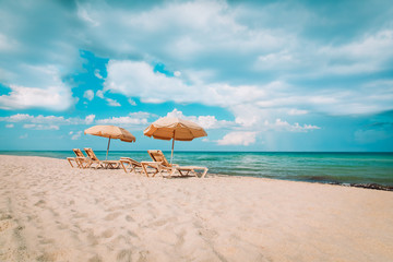 Wall Mural - Beach chairs on tropical vacation, travel to sea concept